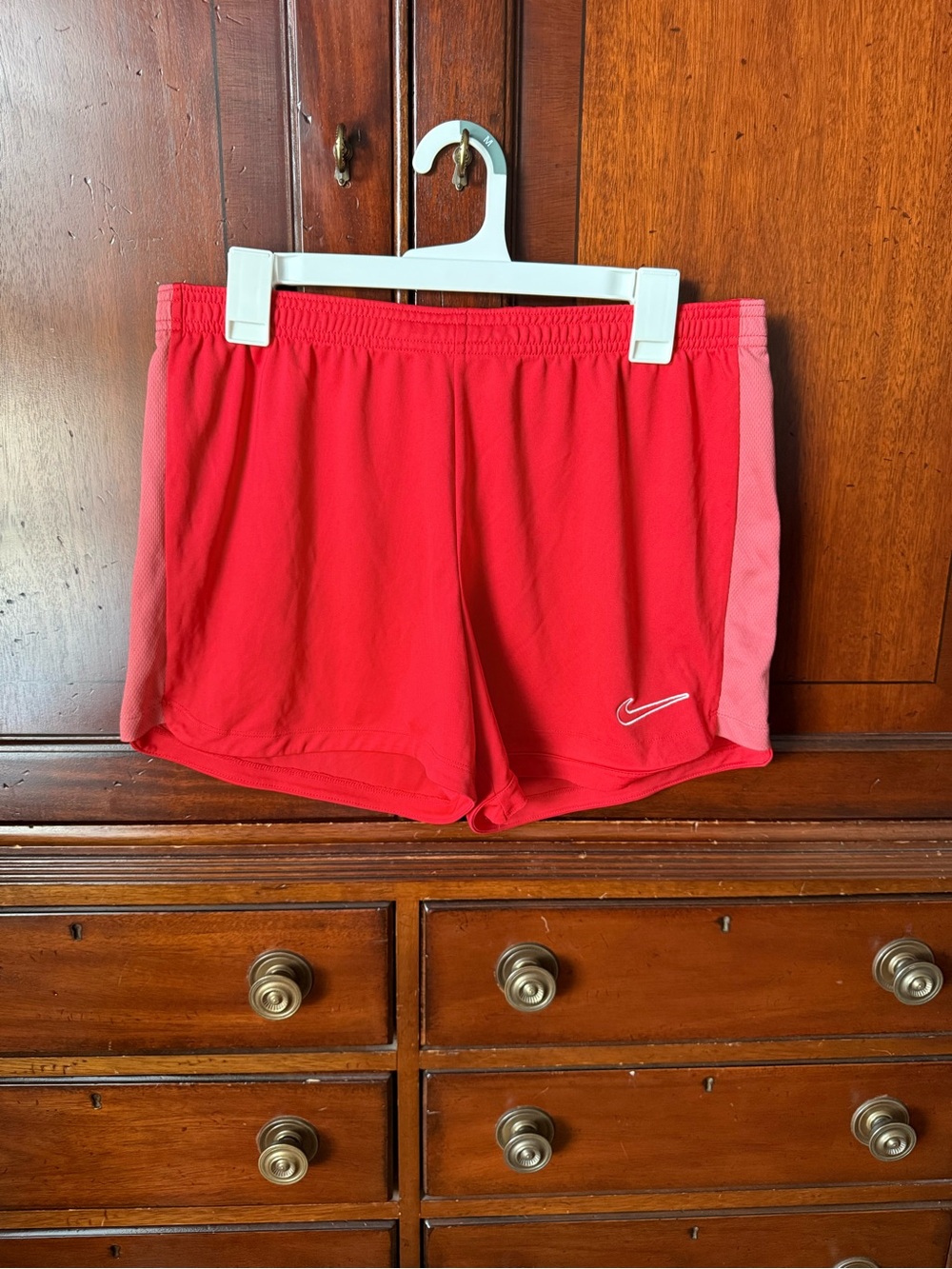 Nike Women's Red Athletic Shorts with orange Side Panels